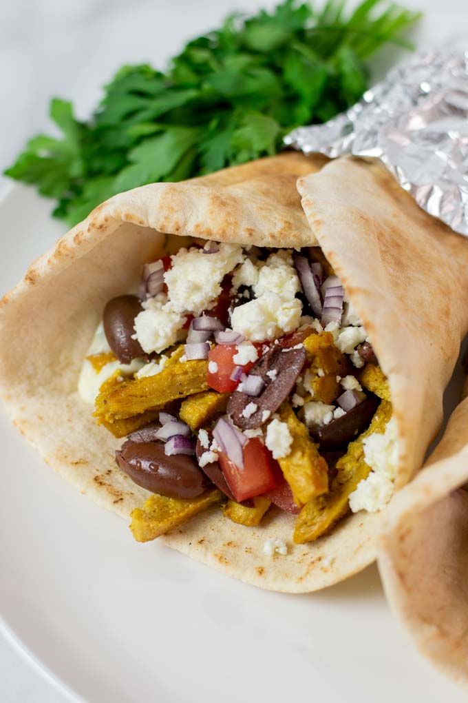 Closeup view on the filling of a Chicken Gyro.