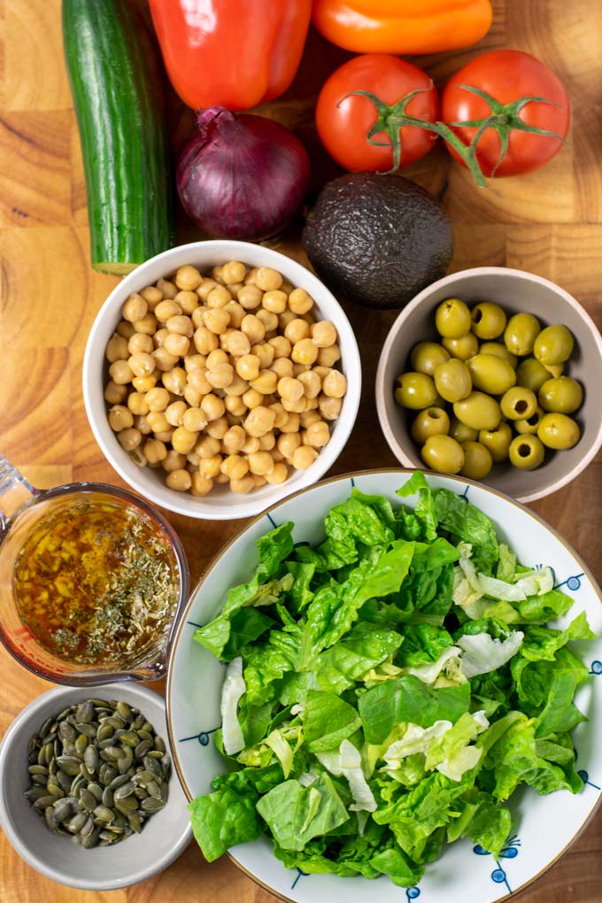 Ingredients for the Chopped Salad are collected before preparation on a board.