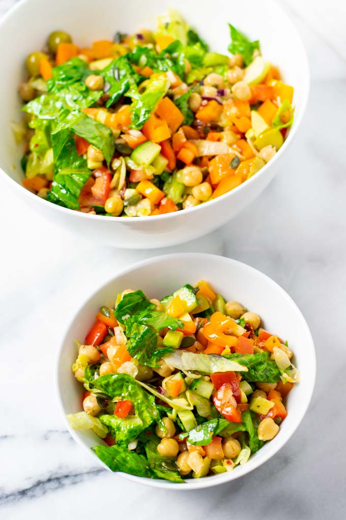 A small portion of the Chopped Salad with the big serving bowl in the background.