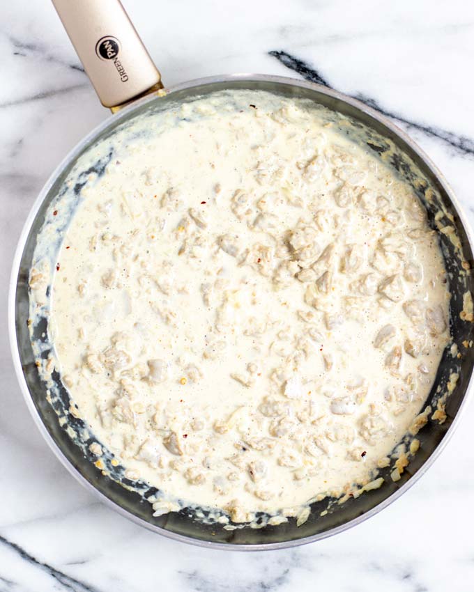 Top view of a pan with the sauce of the vegan Sausage Pasta.