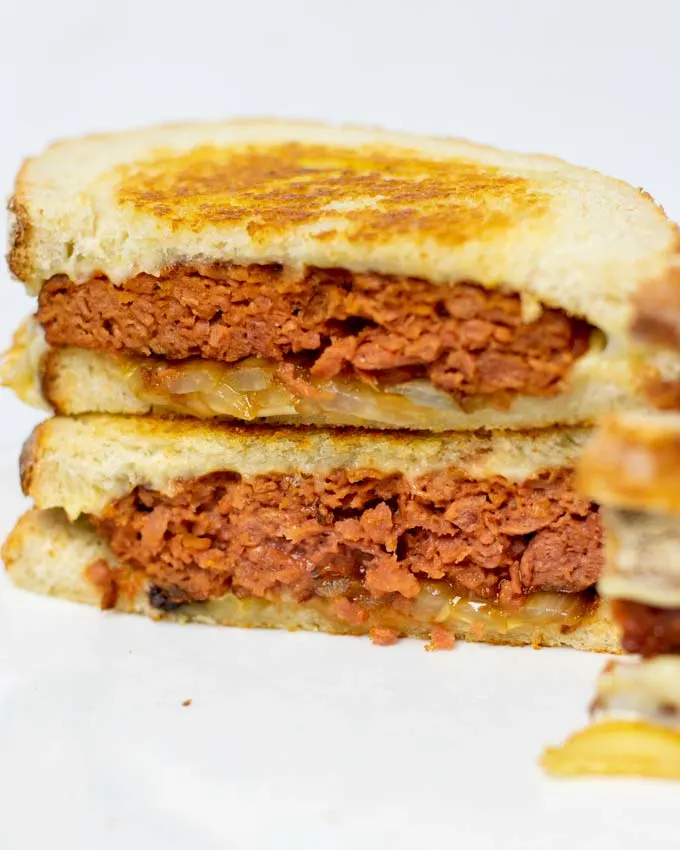 Closeup on open-cut Patty Melt stacks, showing the insides of the patties.
