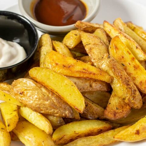 Closeup of the Steak Fries served on a white plate.