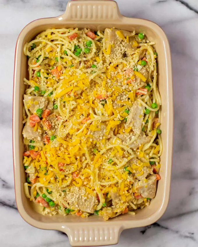 Top view of a casserole dish with the Chicken Noodle Casserole sprinkled with vegan cheese and panko breadcrumbs.