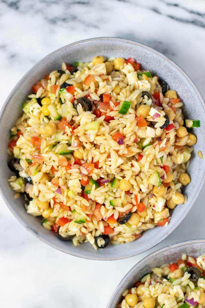 Top view on one serving bowl full of the Orzo Salad.