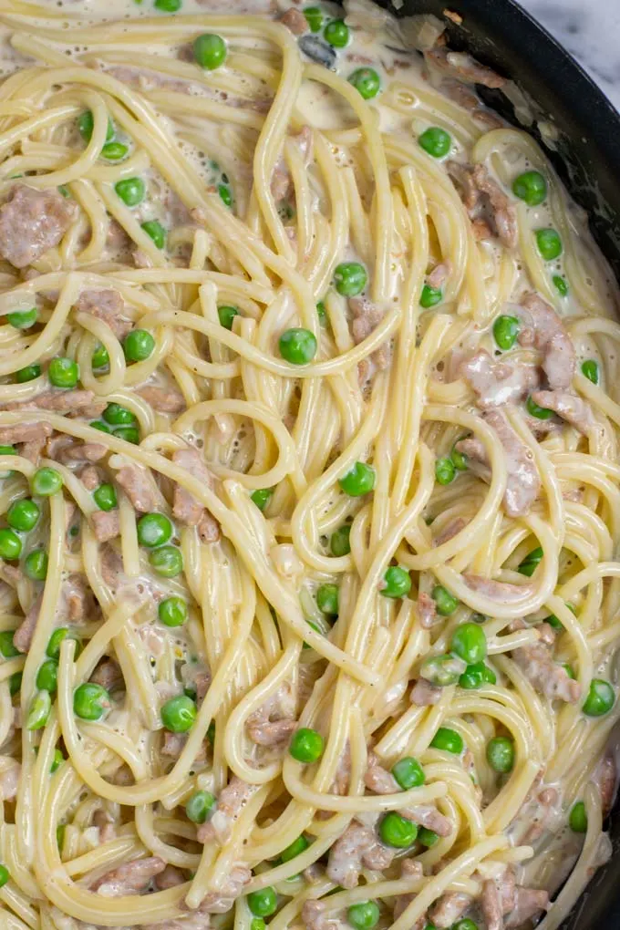 Closeup on the Pea Pasta with the creamy sauce, and all ingredients clearly visible.