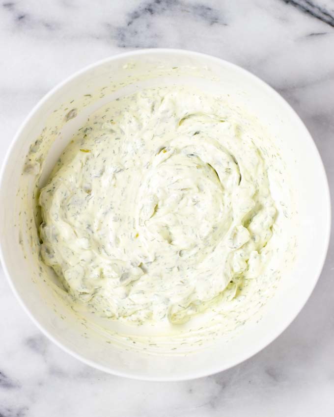 Top view of a large mixing bowl with the mixed ingredients.