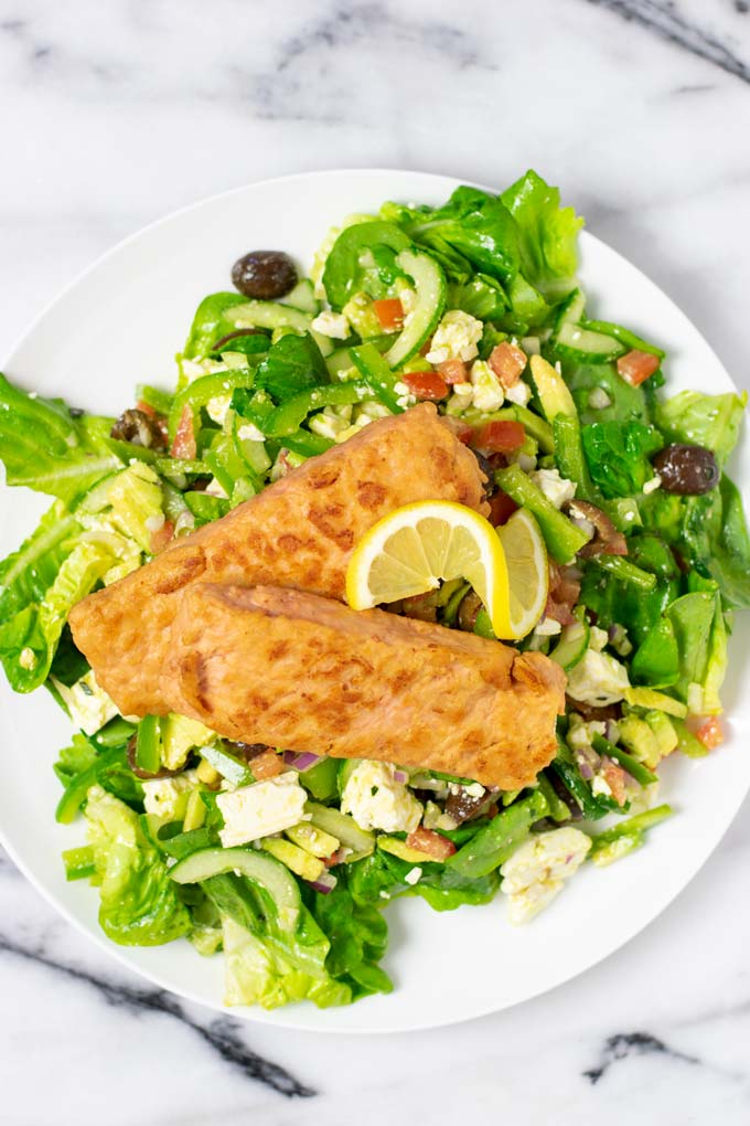 Salmon Salad is garnished with fresh lemon.
