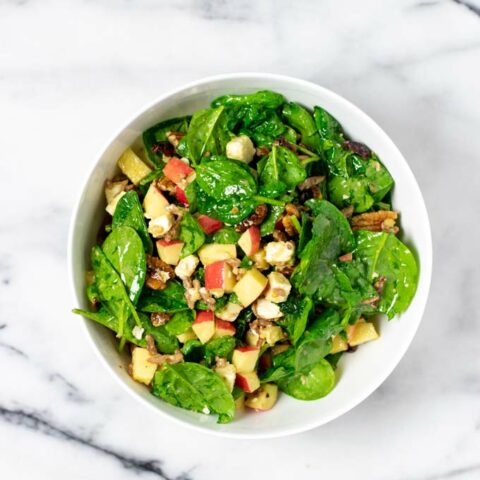 Top view on a serving bowl with the Spinach Salad