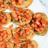 A closeup view of several Bruschetta slices.