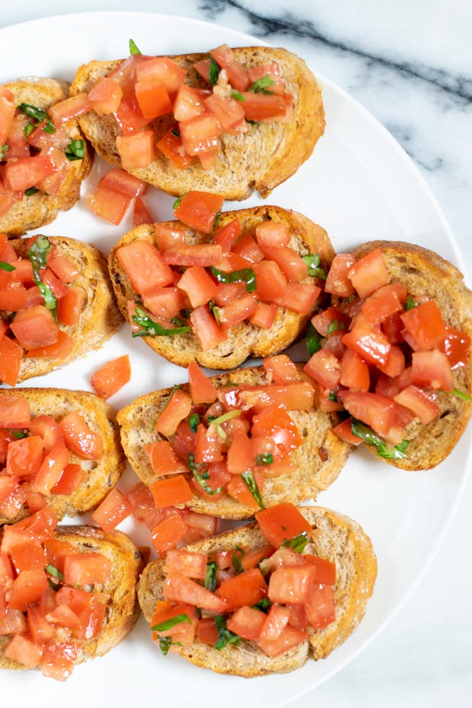 A closeup view of several Bruschetta slices.