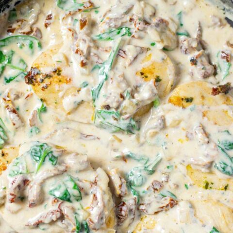 The Creamy Tuscan Chicken is ready in a pan.