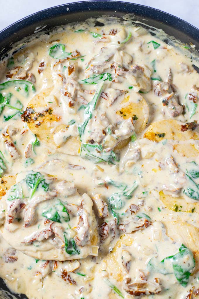 The Creamy Tuscan Chicken is ready in a pan.