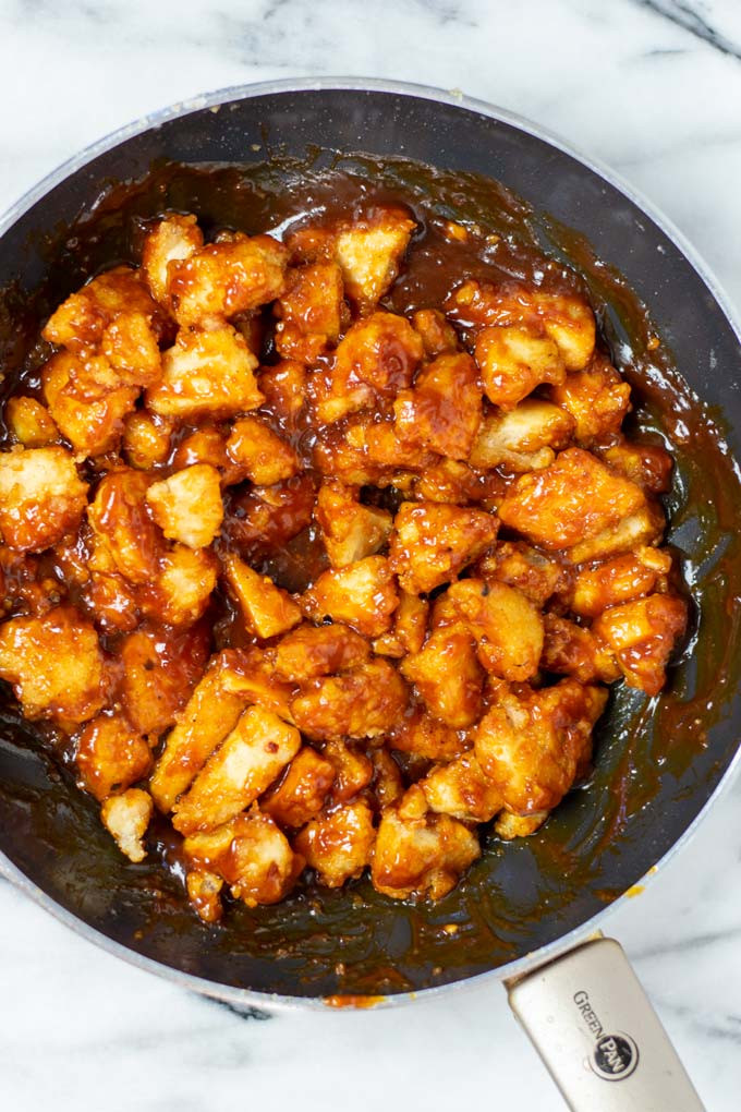 Top view on a pan with the ready Sweet and Sour Chicken.