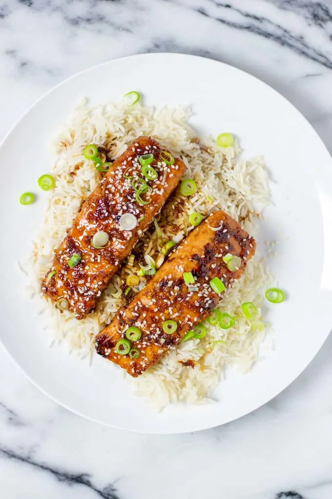 A large portion of Teriyaki Salmon served over rice.