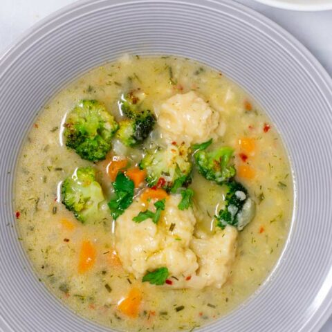 Top view of a plate with the Dumpling Soup.