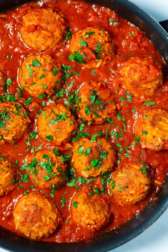 Closeup of Porcupine Meatballs in a pan.