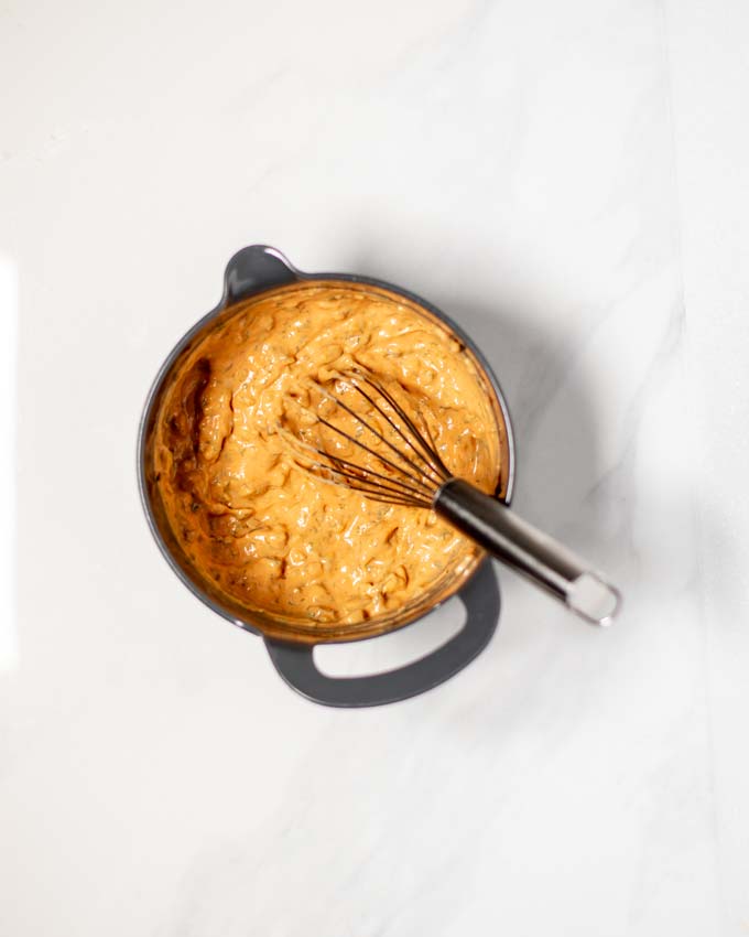 Top view of a mixing bowl with all ingredients of the Hot Dog Sauce after mixing.