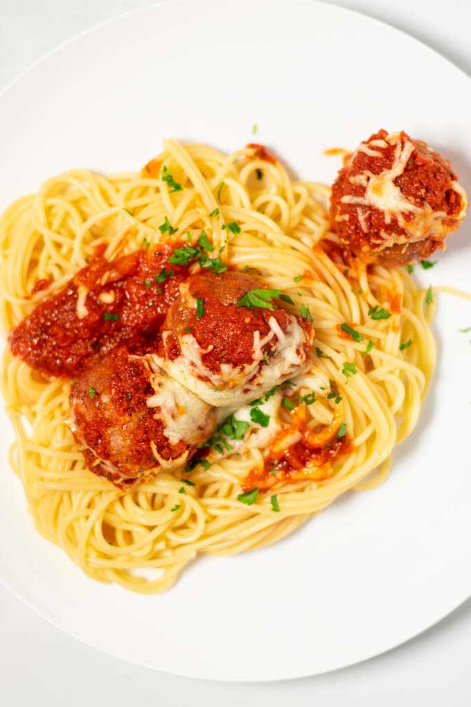 A portion of Meatball Bake served with pasta.