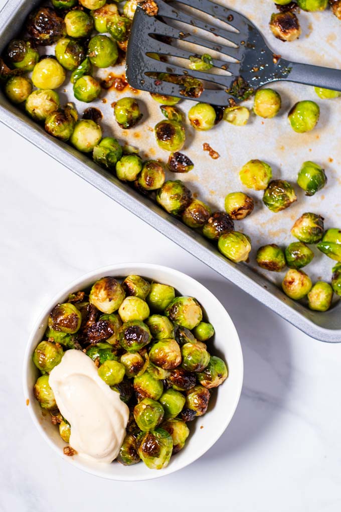 A bowl with a portion of Roasted Brussels Sprouts.