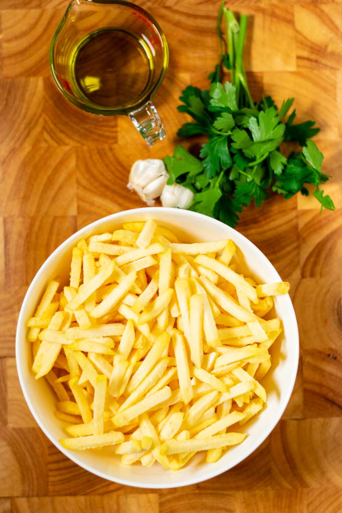 Ingredients needed to make Garlic Fries are collected before preparation.