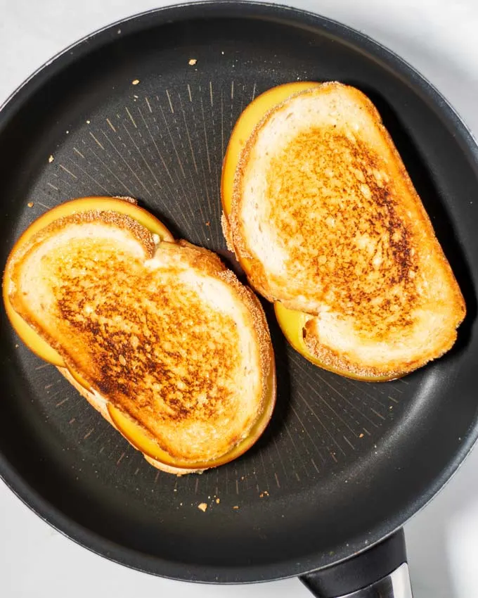 Grilled Cheese Sandwiches in a pan.