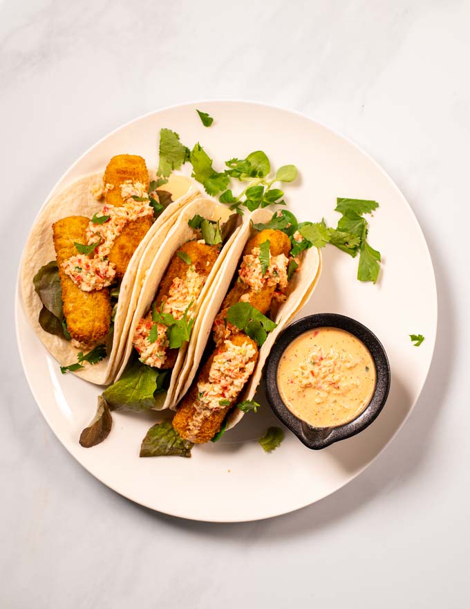 Top view on a serving of tacos with Baja Sauce.