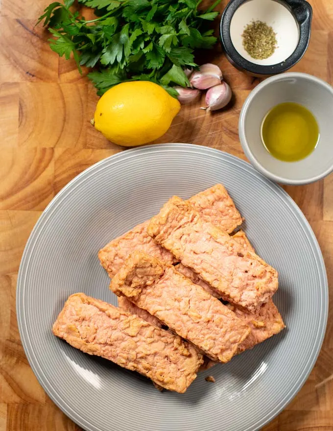 Ingredients needed to make Baked Salmon are collected before preparation.