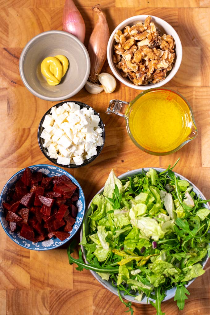 Ingredients needed for making Beet Salad are assembled on a board.