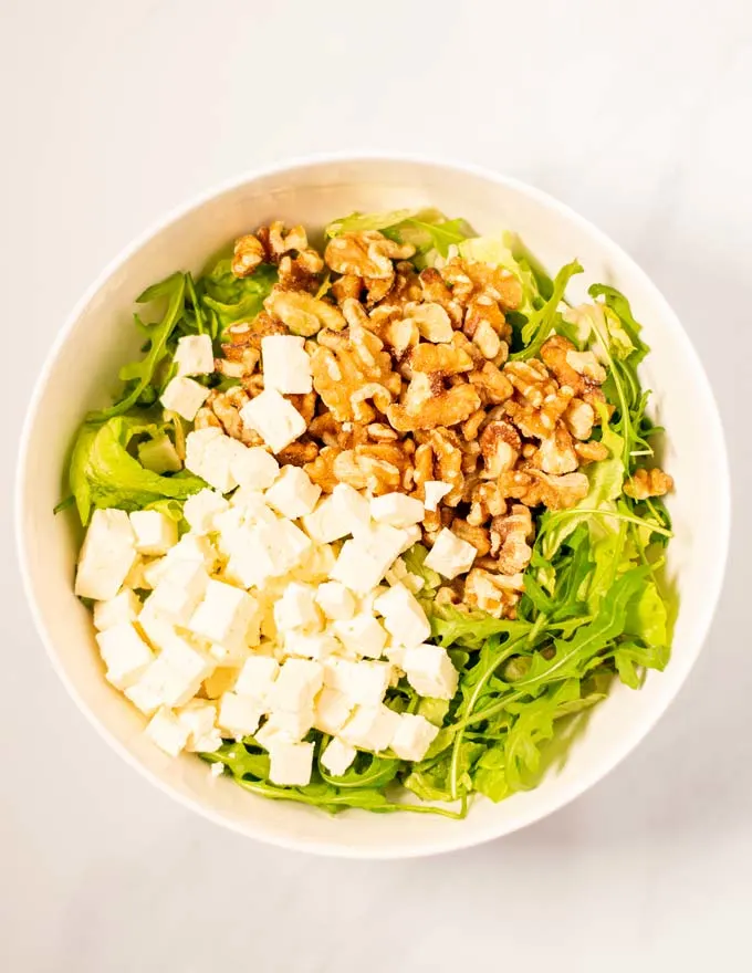 Top view on a large white bowl, showing the first step in making Beet Salad.