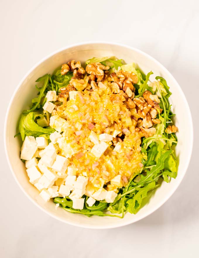 Showing how the dressing is given over the salad ingredients.