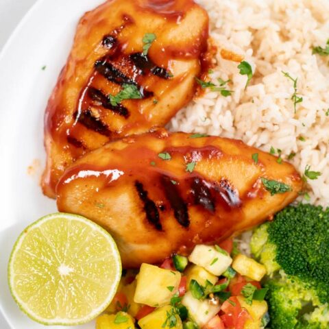 Closeup on two filets of Huli Huli Chicken.