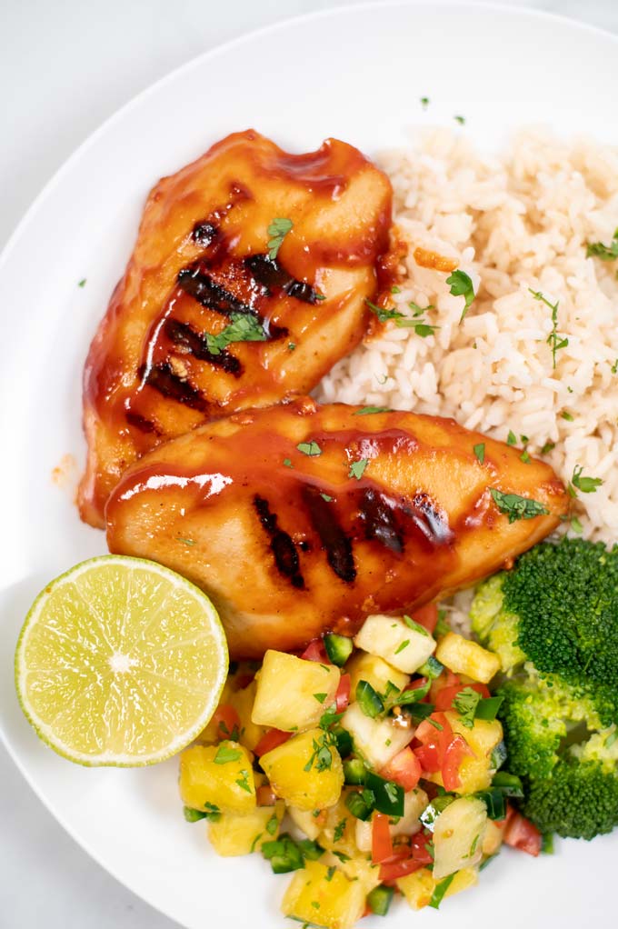 Closeup on two filets of Huli Huli Chicken.