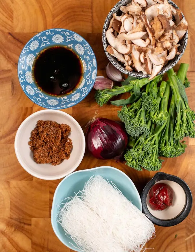 Ingredients needed to make Japchae are collected on a board.
