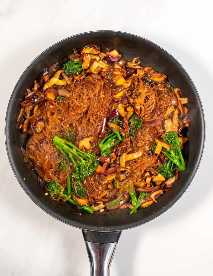 Top view of Japchae in a large frying pan.