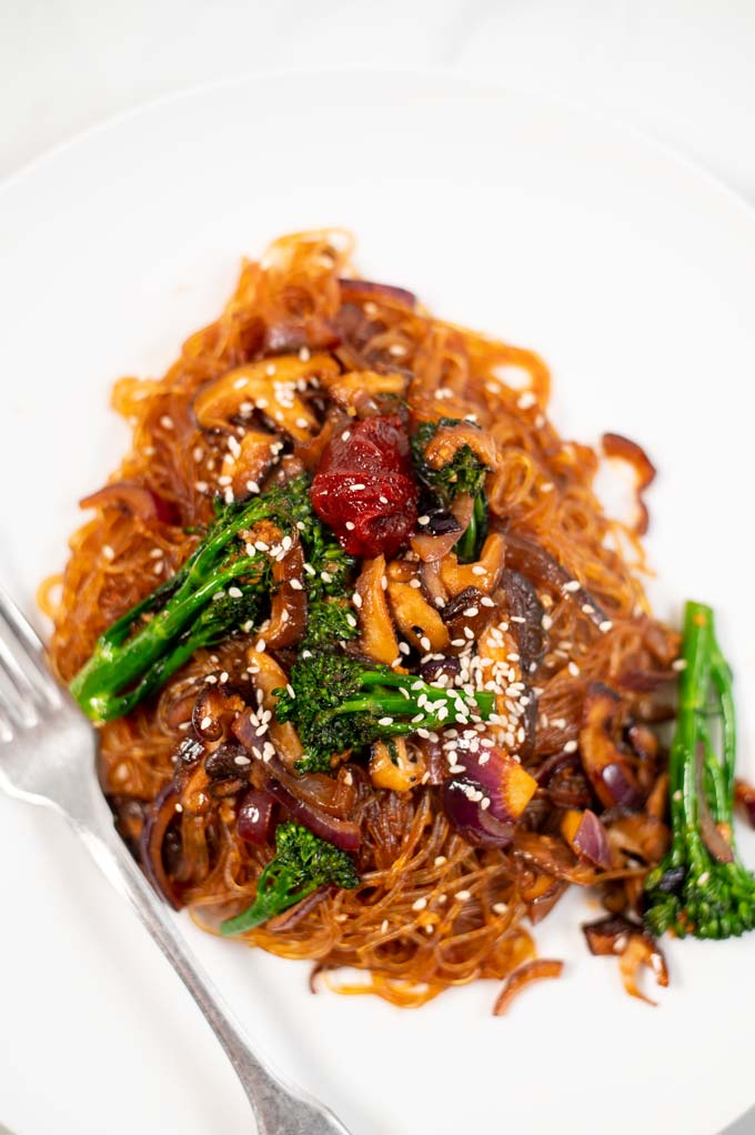 Portion of Japchae served on a white plate.