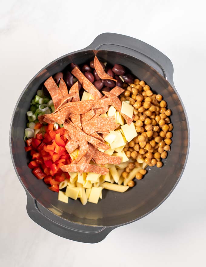 All Antipasto Salad ingredients are given into a large mixing bowl.