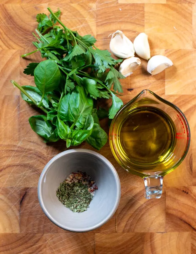 Ingredients for Bread Dipping Oil are collected on a board.