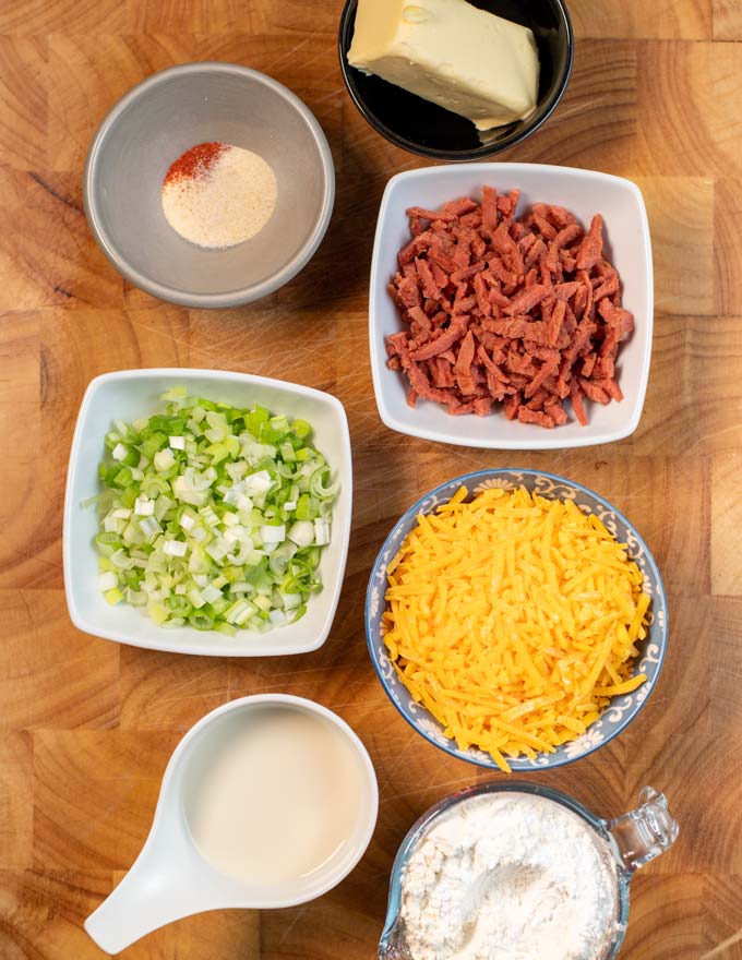 Ingredients for making Cheese Puffs are collected before preparation on a board.