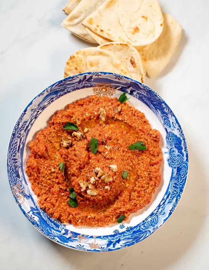 Bread is served with Muhammara.