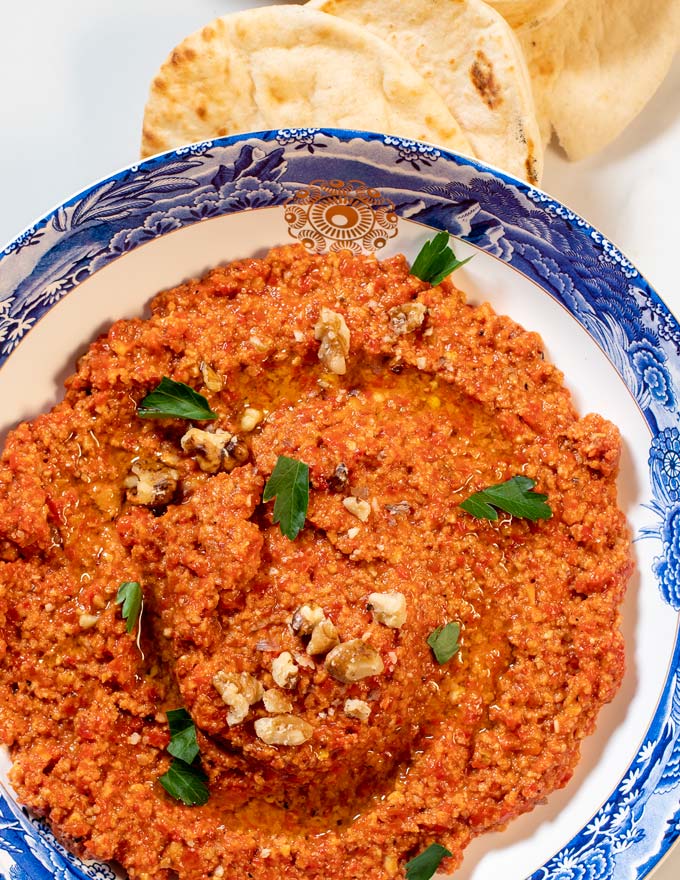 Closeup of Muhammara on a nicely decorated plate.
