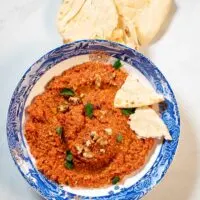 Collage of two photos of Muhammara with recipe title text.