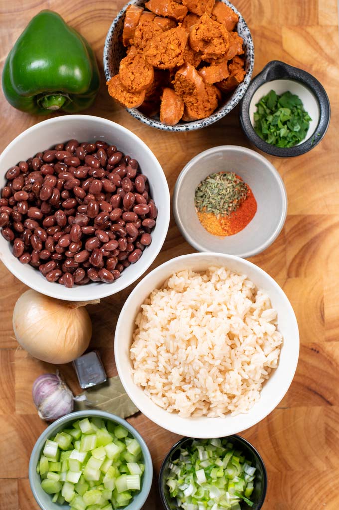 Ingredients needed to make Red Beans and Rice are collected on a board.