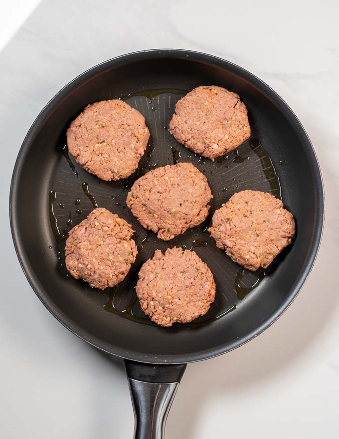View on a frying pan with Sausage Patties before frying.