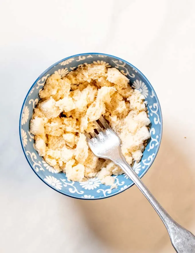 Breadcrumbs are mixed with some milk.