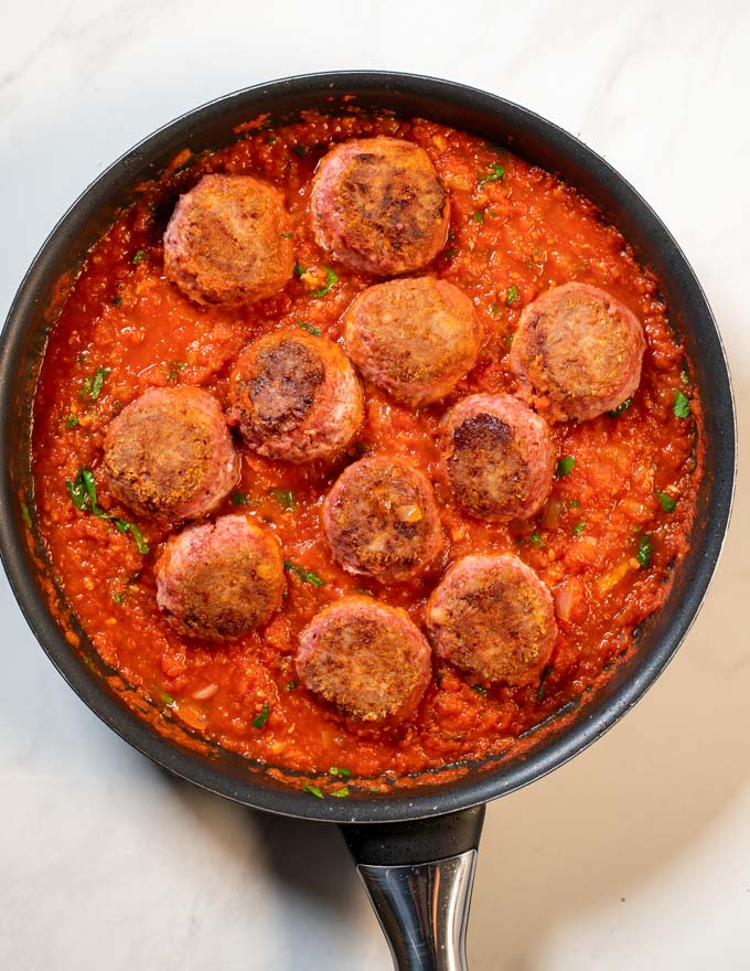 Meatballs in a pan with the Spaghetti Sauce.