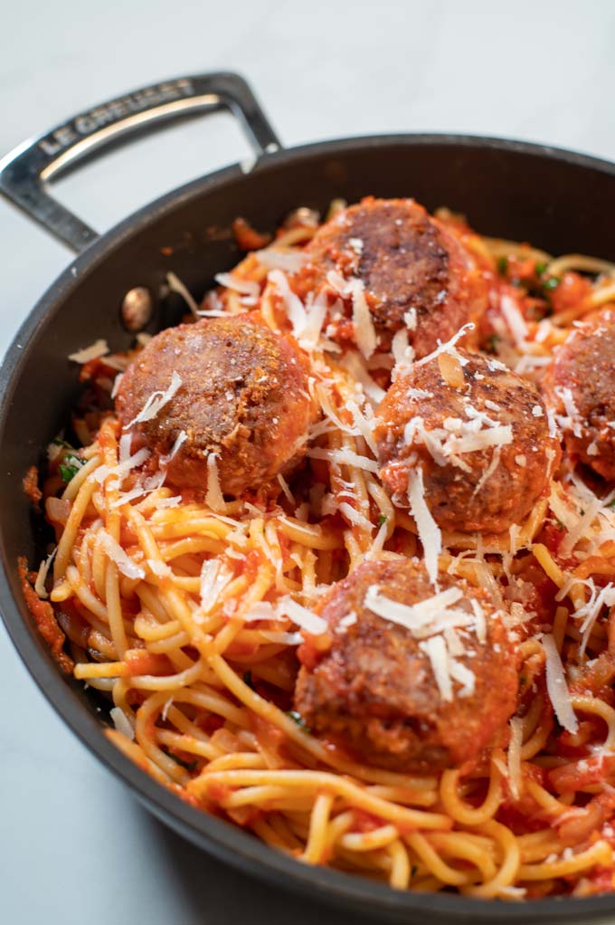 Some vegan parmesan is sprinkled over Spaghetti and Meatballs.