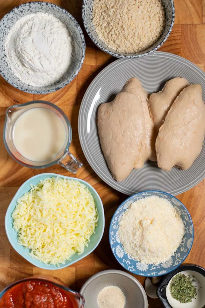 Ingredients needed for Chicken Parmesan are collected before preparation.