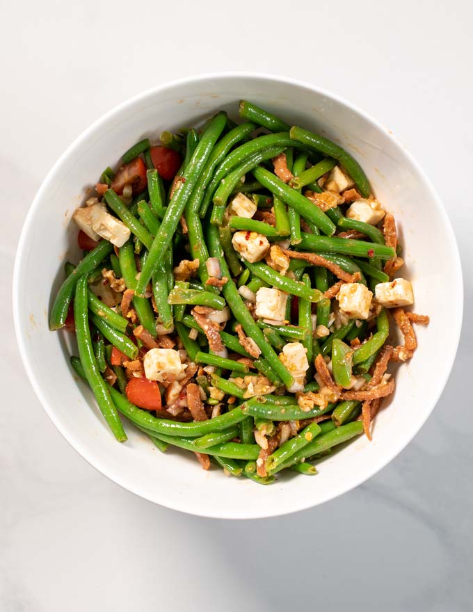 Top view of a large serving bowl with Green Bean Salad.