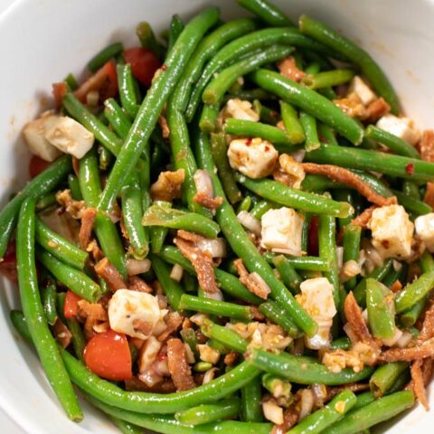 Closeup of a serving bowl with the Green Bean Salad.