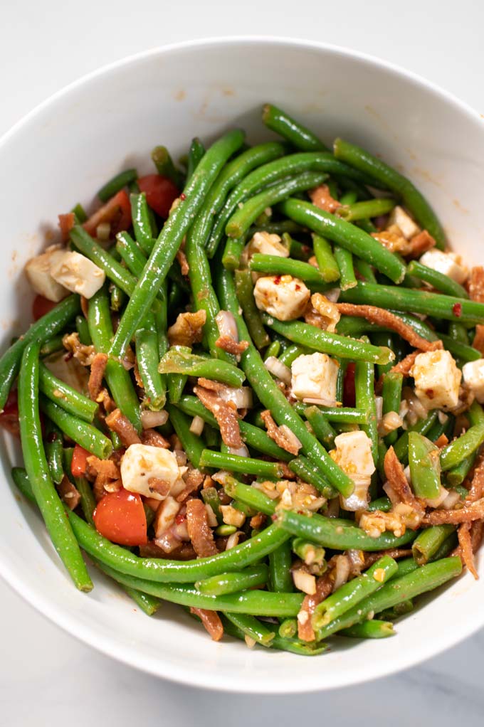 Closeup of a serving bowl with the Green Bean Salad.